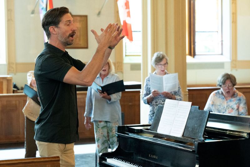 Roland singing during choir practice.